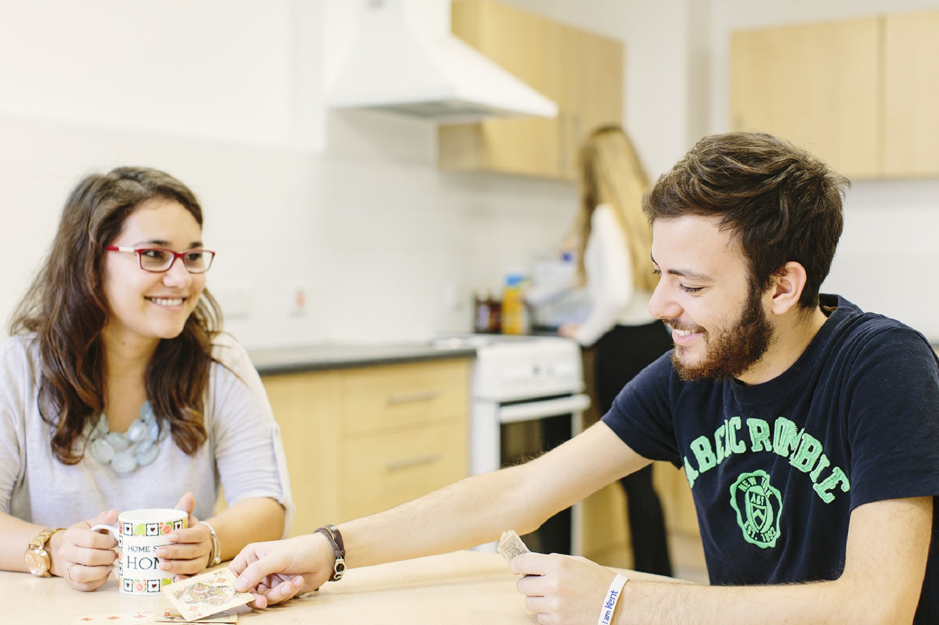 Students talking in a communal kitchen